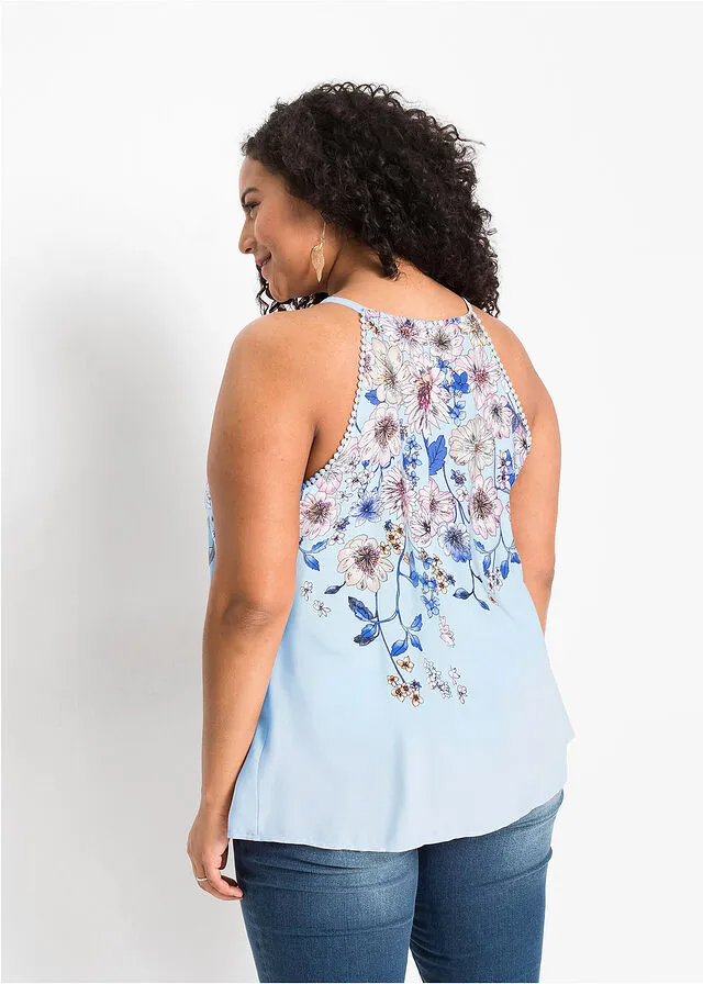 Blusa sin mangas azul pálido con flores