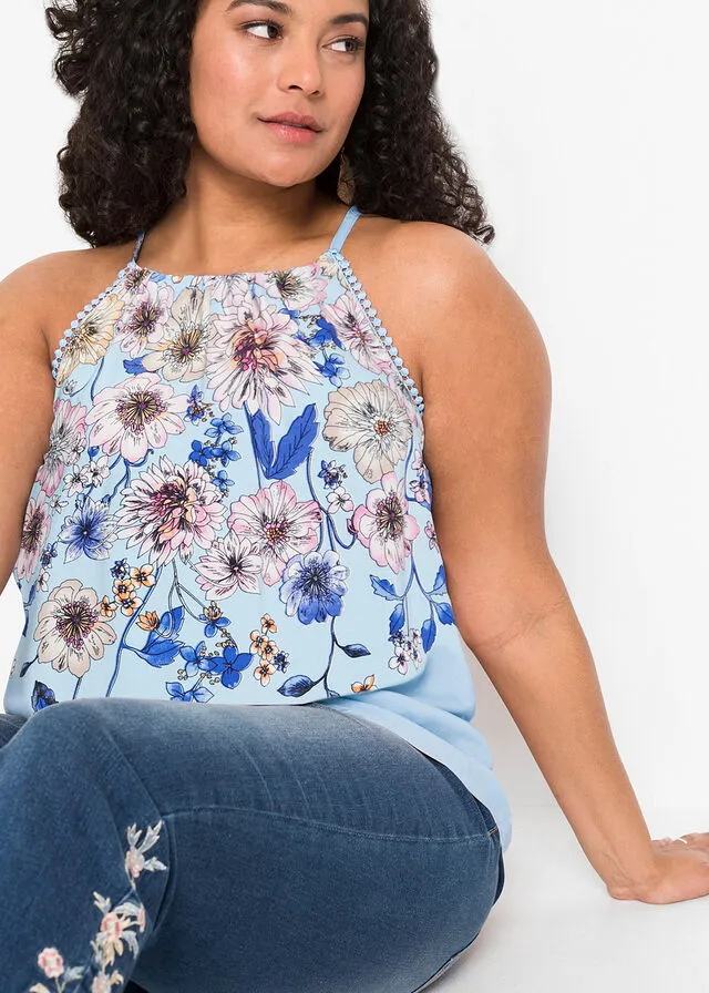 Blusa sin mangas azul pálido con flores