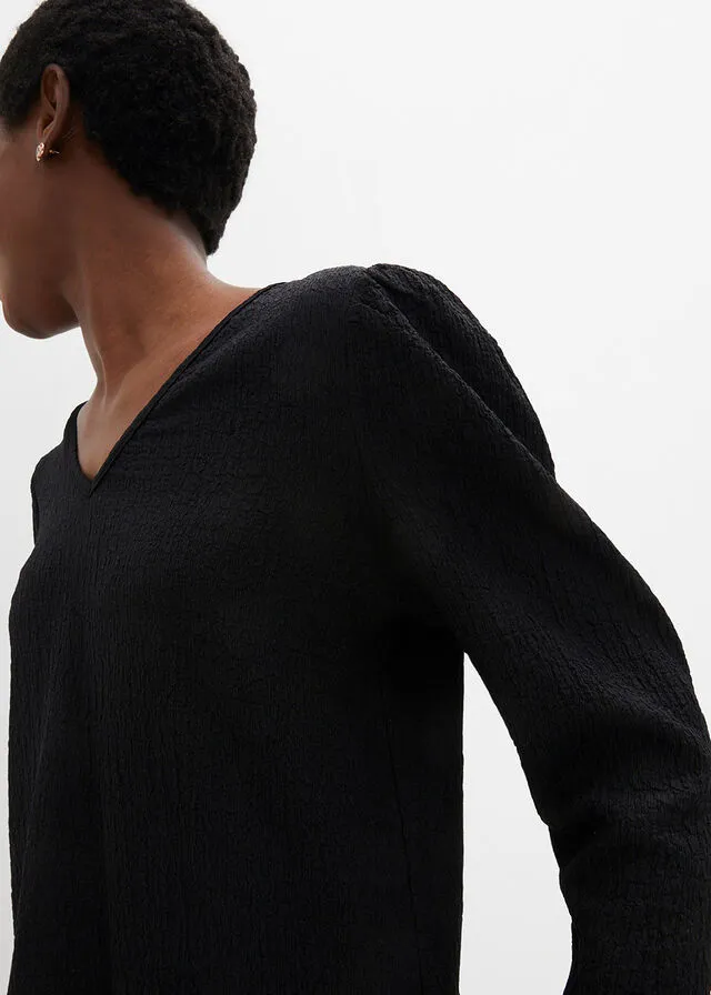 Camiseta de punto texturizado con mangas largas ligeramente abullonadas Negro