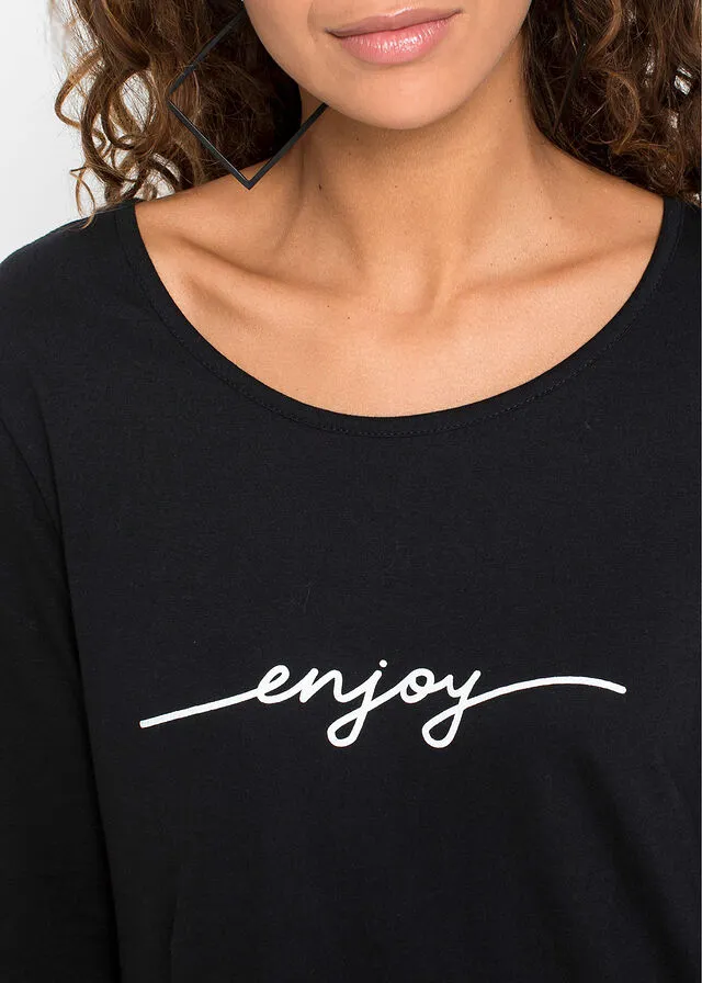 CAMISETA LARGA CON ABERTURAS Y ESTAMPADO NEGROBLANCO