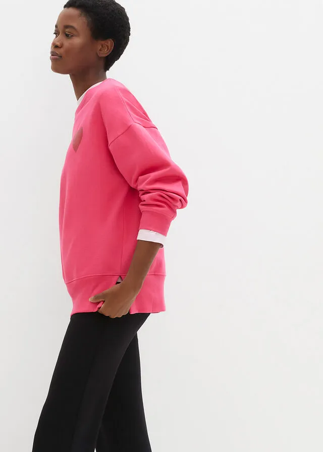 SUDADERA DE ALGODóN ORGáNICO CON CORTE CóMODO Y ABERTURAS LATERALES ROSA OSCUROROJO CAYENA ESTAMPADO