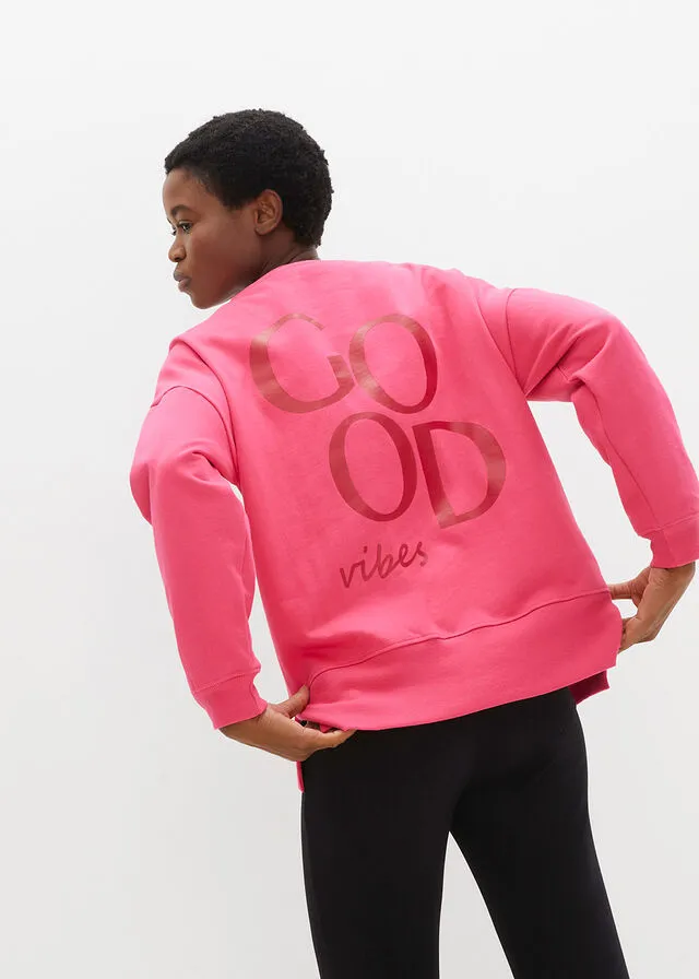 SUDADERA DE ALGODóN ORGáNICO CON CORTE CóMODO Y ABERTURAS LATERALES ROSA OSCUROROJO CAYENA ESTAMPADO