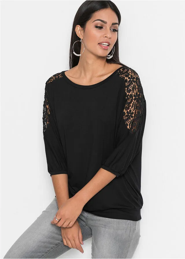 Top amplio con encaje en las mangas Negro
