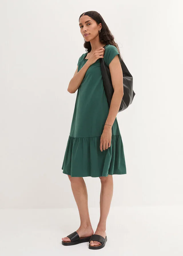 Vestido de punto de algodón con aberturas, mangas de murciélago y largo hasta la rodilla verde mate
